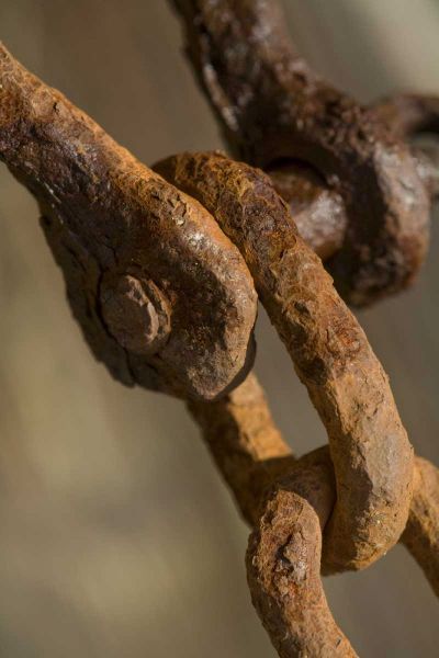USA, Maine, Harpswell Rusted chain on a pier